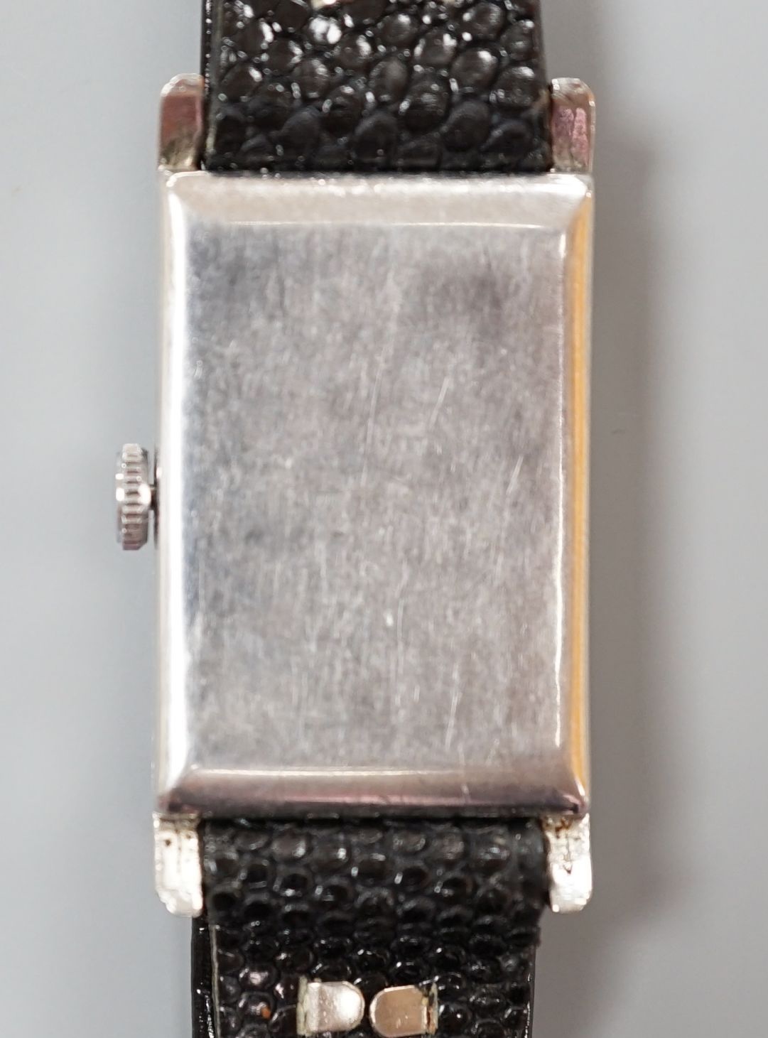 A gentleman's late 1930's stainless steel Omega rectangular black dial manual wind wrist watch, with subsidiary seconds, case diameter 24mm, on later strap.